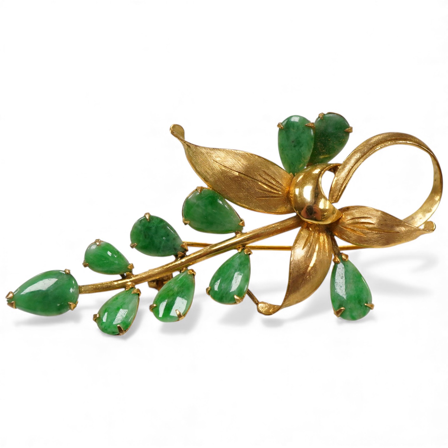 A 14k yellow metal and ten stone jade set foliate brooch, 58mm, gross weight 6 grams.